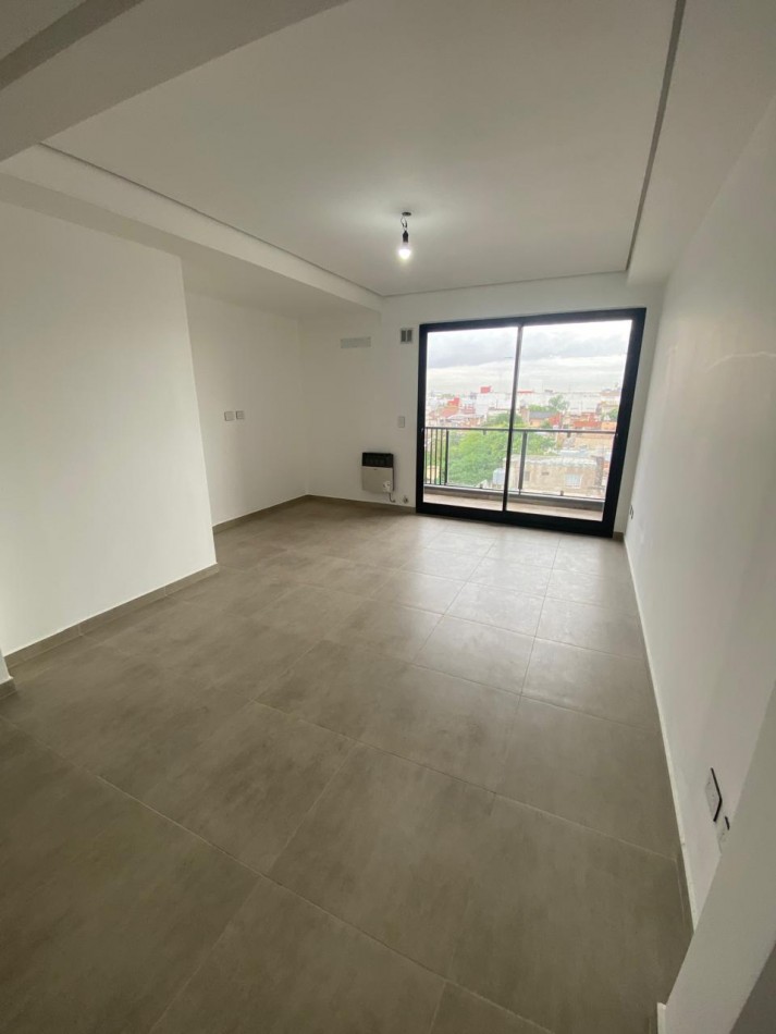 DEPARTAMENTO SEMIPISO A ESTRENAR CON BALCON Y PARRILLA