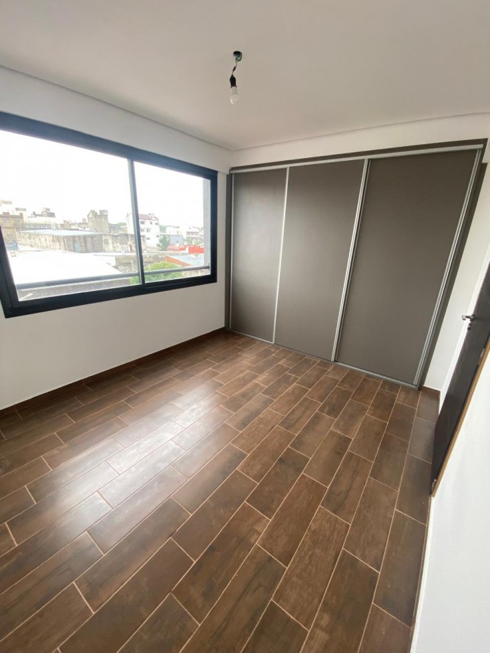 DEPARTAMENTO SEMIPISO A ESTRENAR CON BALCON Y PARRILLA