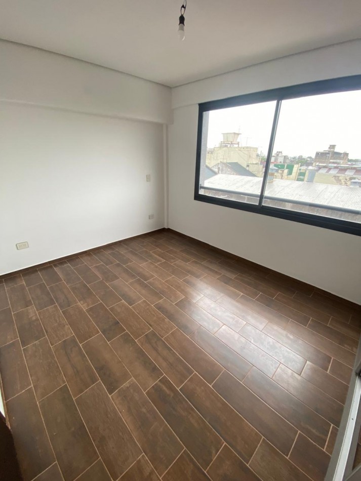 DEPARTAMENTO SEMIPISO A ESTRENAR CON BALCON Y PARRILLA